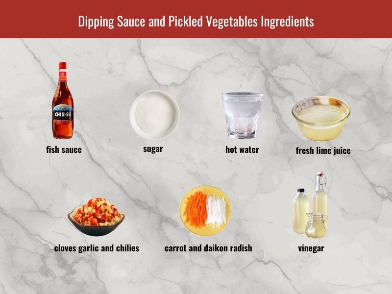Vietnamese dipping sauce and pickled vegetables ingredients with fish sauce, lime, garlic, chili, carrot, and daikon