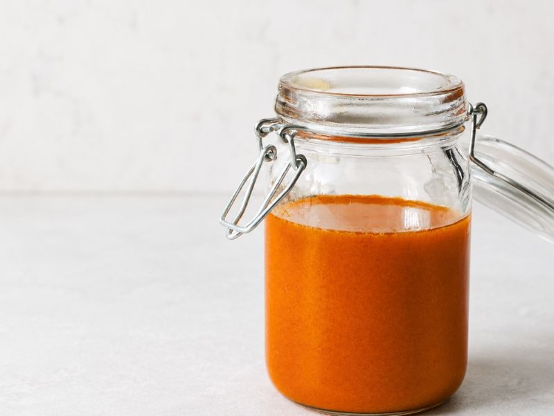 Homemade buffalo sauce with smooth glossy texture