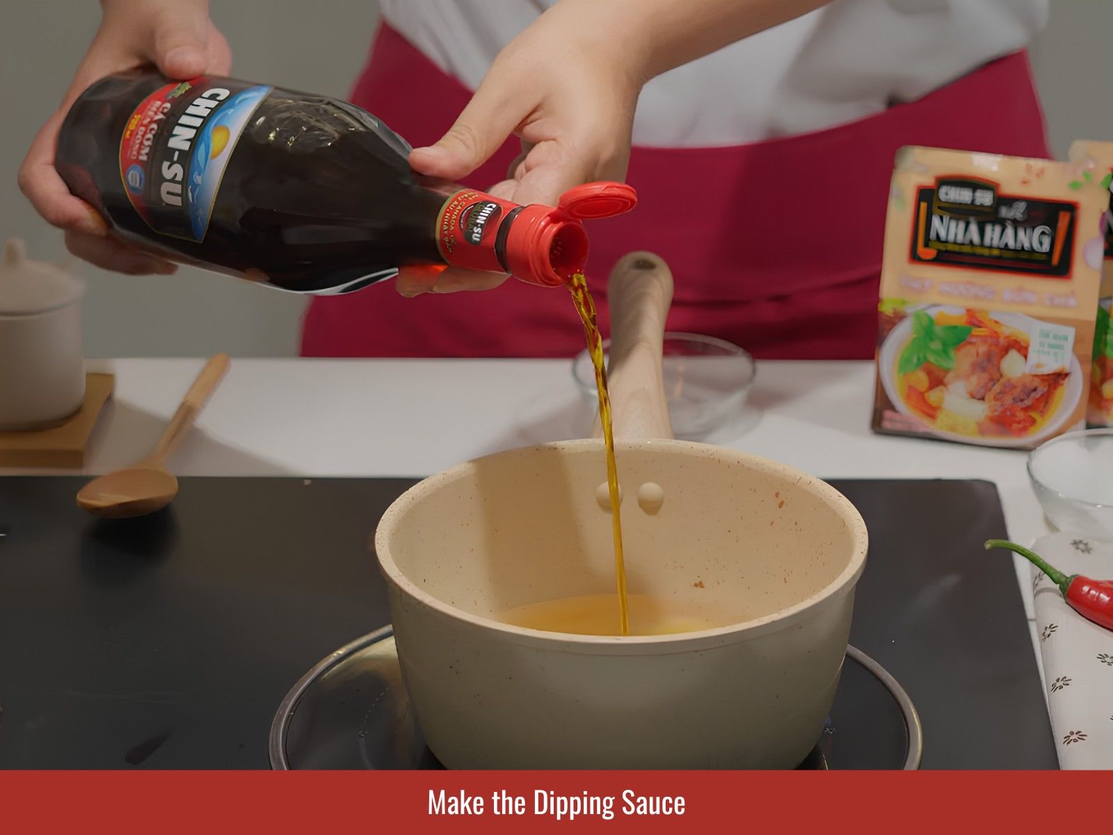 making Warm bun cha dipping sauce balanced with fish sauce, sugar, lime