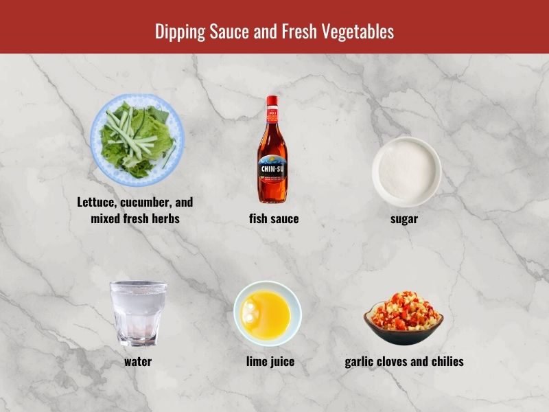 Cha gio dipping sauce ingredients including fish sauce, sugar, lime, garlic, chili, lettuce, herbs, and vegetables