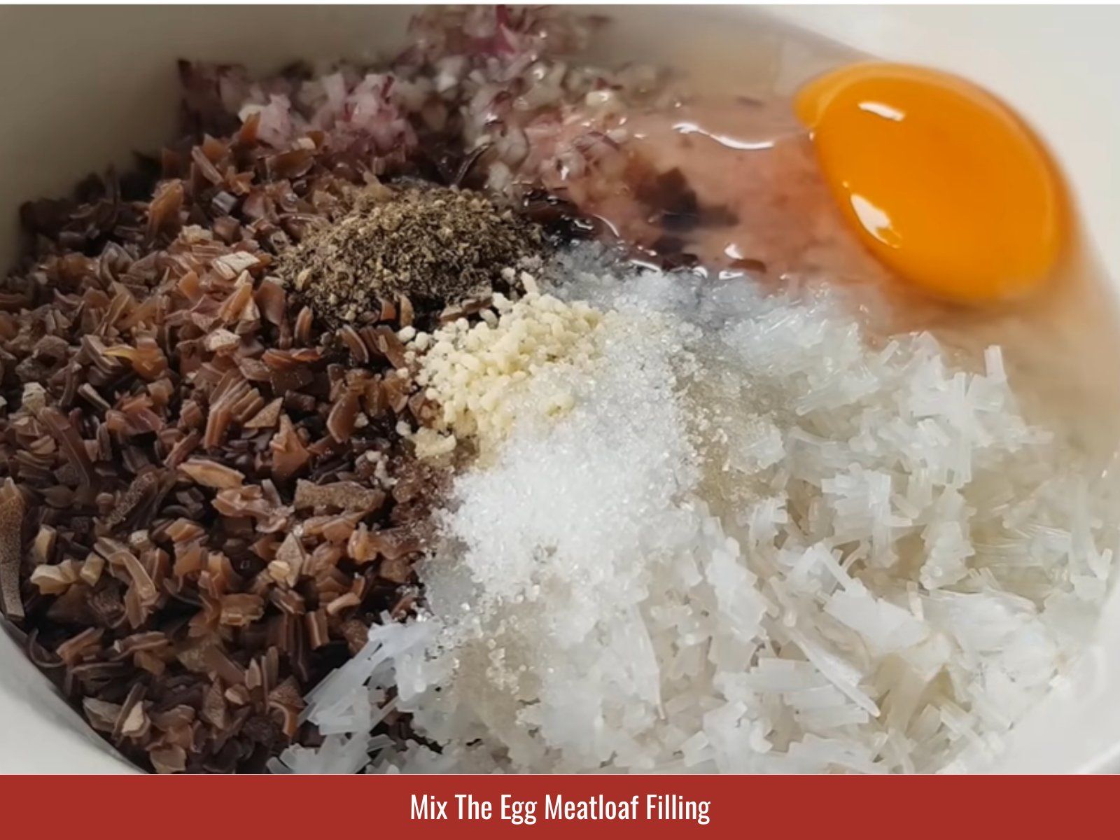 Mixing ground pork filling for egg meatloaf