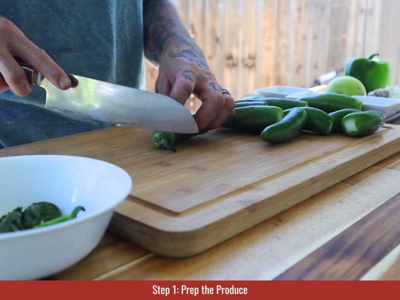 Chop jalapeños, apple, bell pepper, and garlic into rough pieces for blending