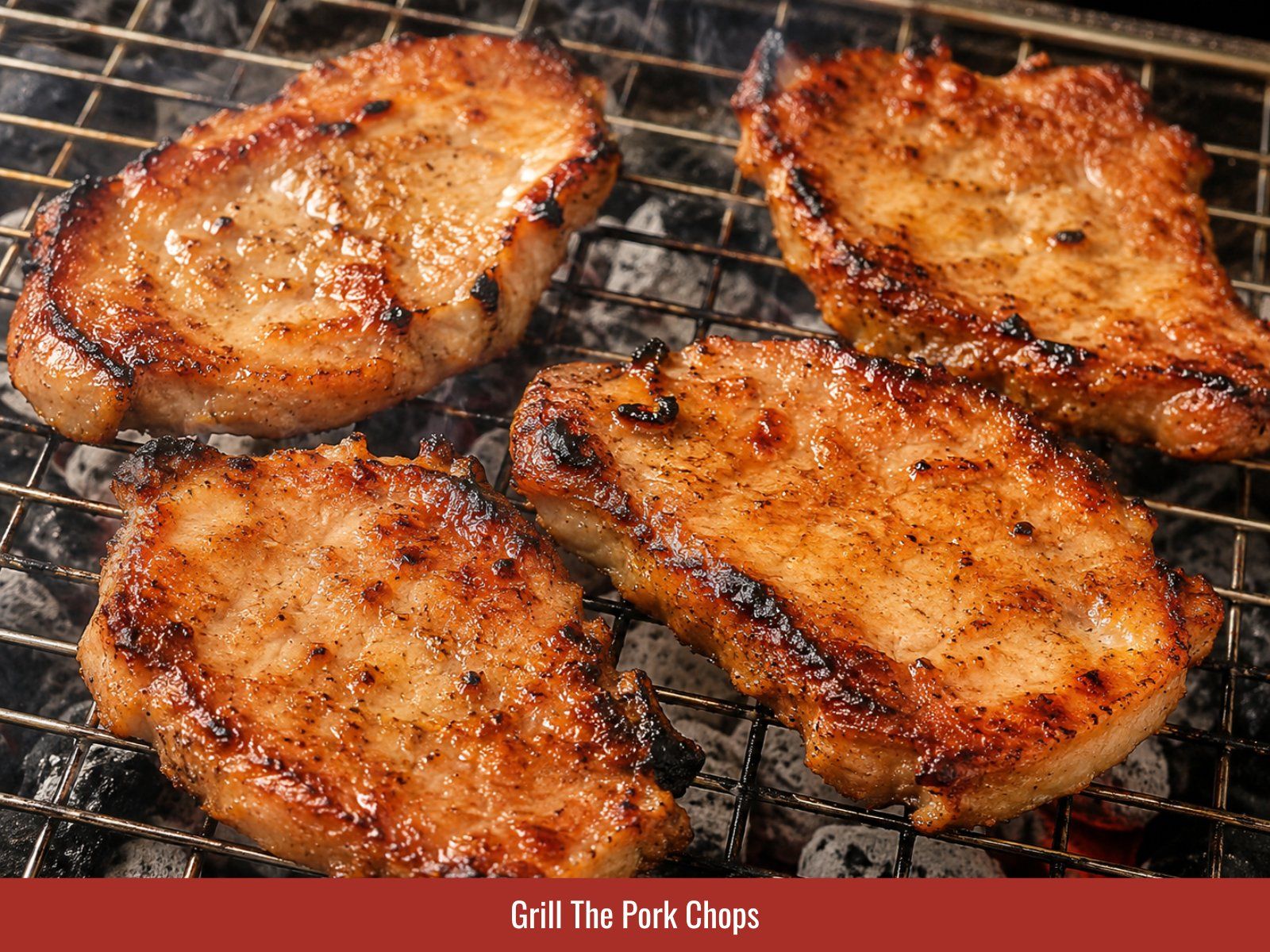 Marinated pork chops grilling over charcoal heat