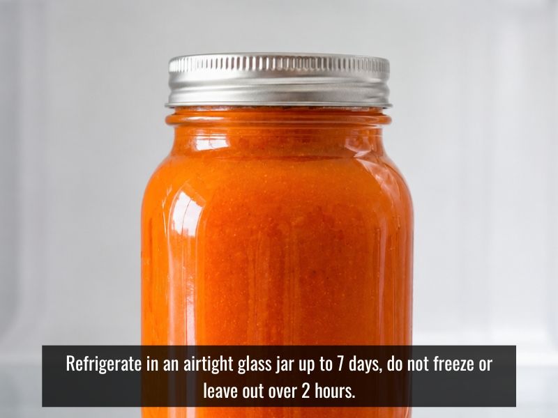 Homemade buffalo sauce stored in a glass jar