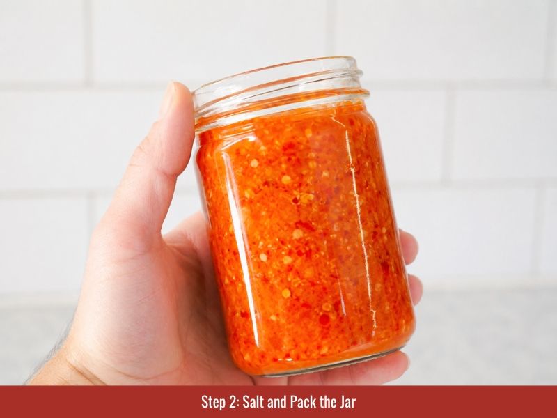 Mix pepper mash with salt, pack into sterilized jars for fermented