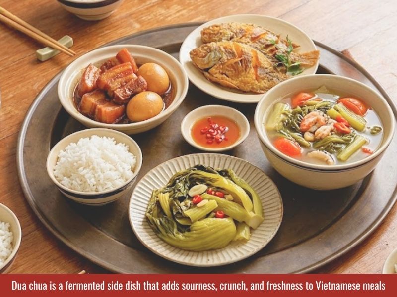 Serving dua chua with Vietnamese meals including rice, braised pork, fried fish, and savory dishes