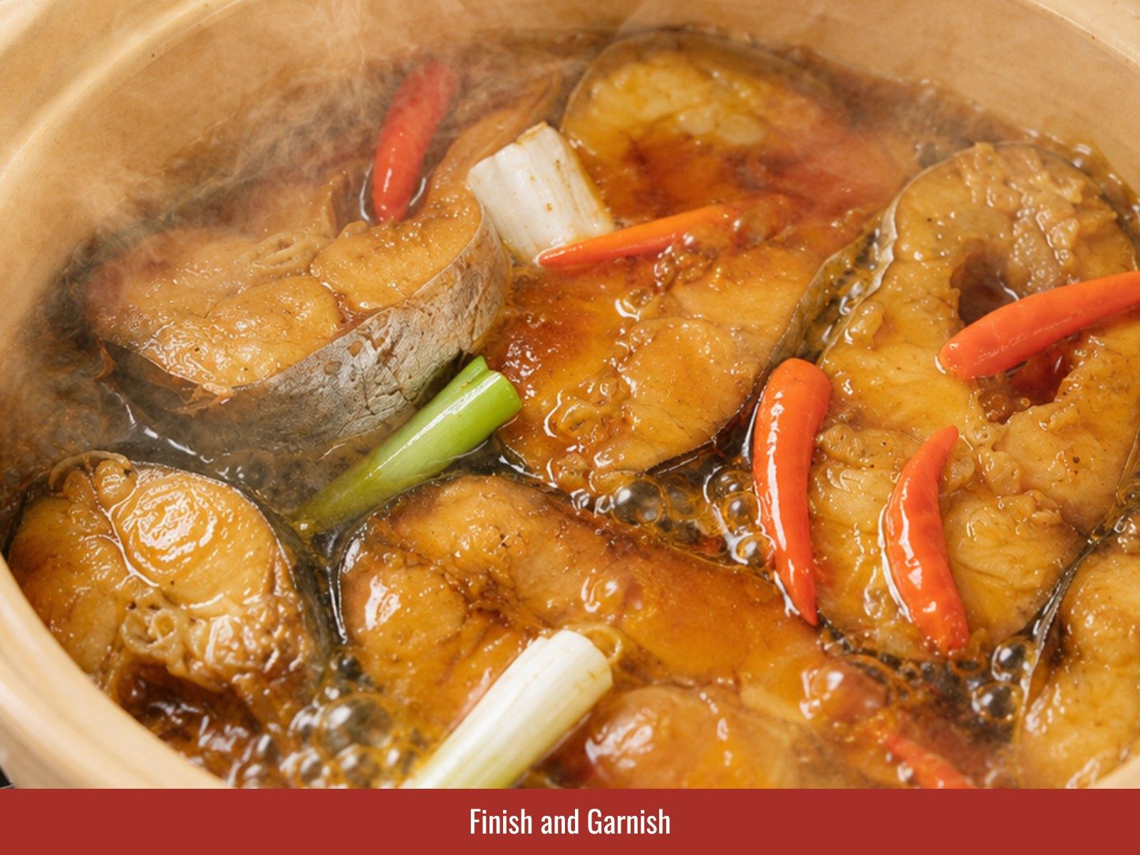 Garnish Vietnamese catfish with scallions and pepper