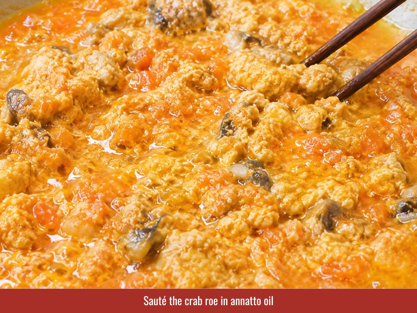 Sauté crab roe in annatto oil