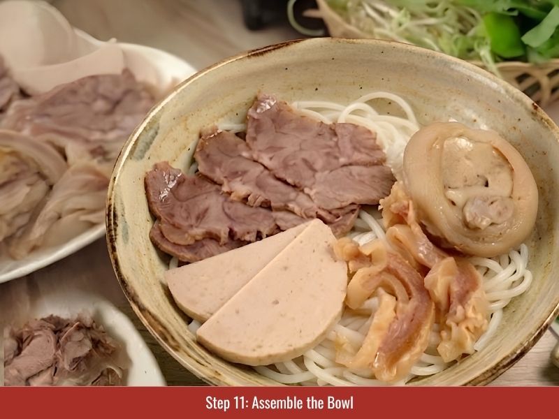 Assembling bun bo Hue with noodles, sliced meats, spicy broth, herbs, onion, and chili toppings