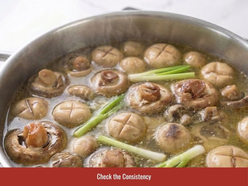Checking chao ga consistency and adjusting the broth level before serving