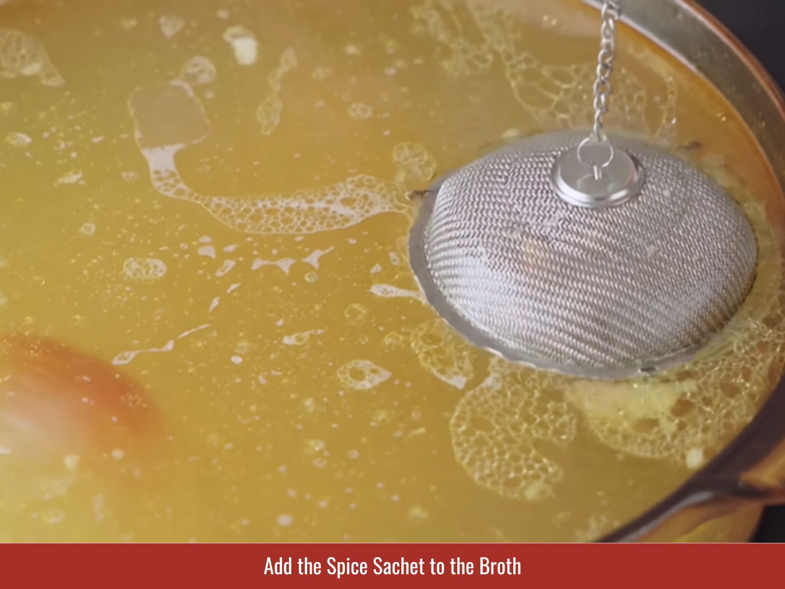 Adding spice sachet to broth