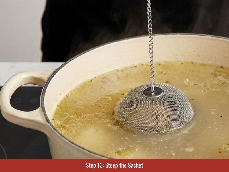Steeping the pho spice sachet in chicken broth to develop aromatic flavor
