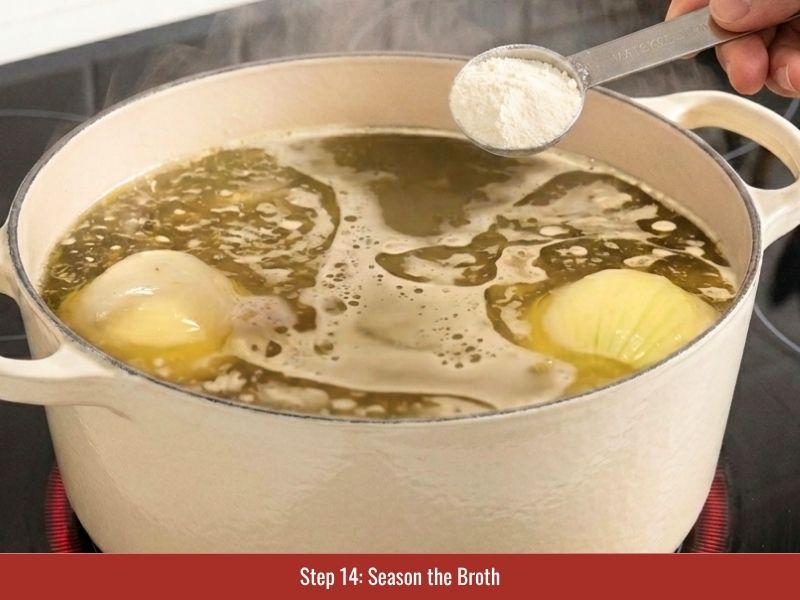 Seasoning chicken pho broth with fish sauce, rock sugar, salt, and savory seasonings