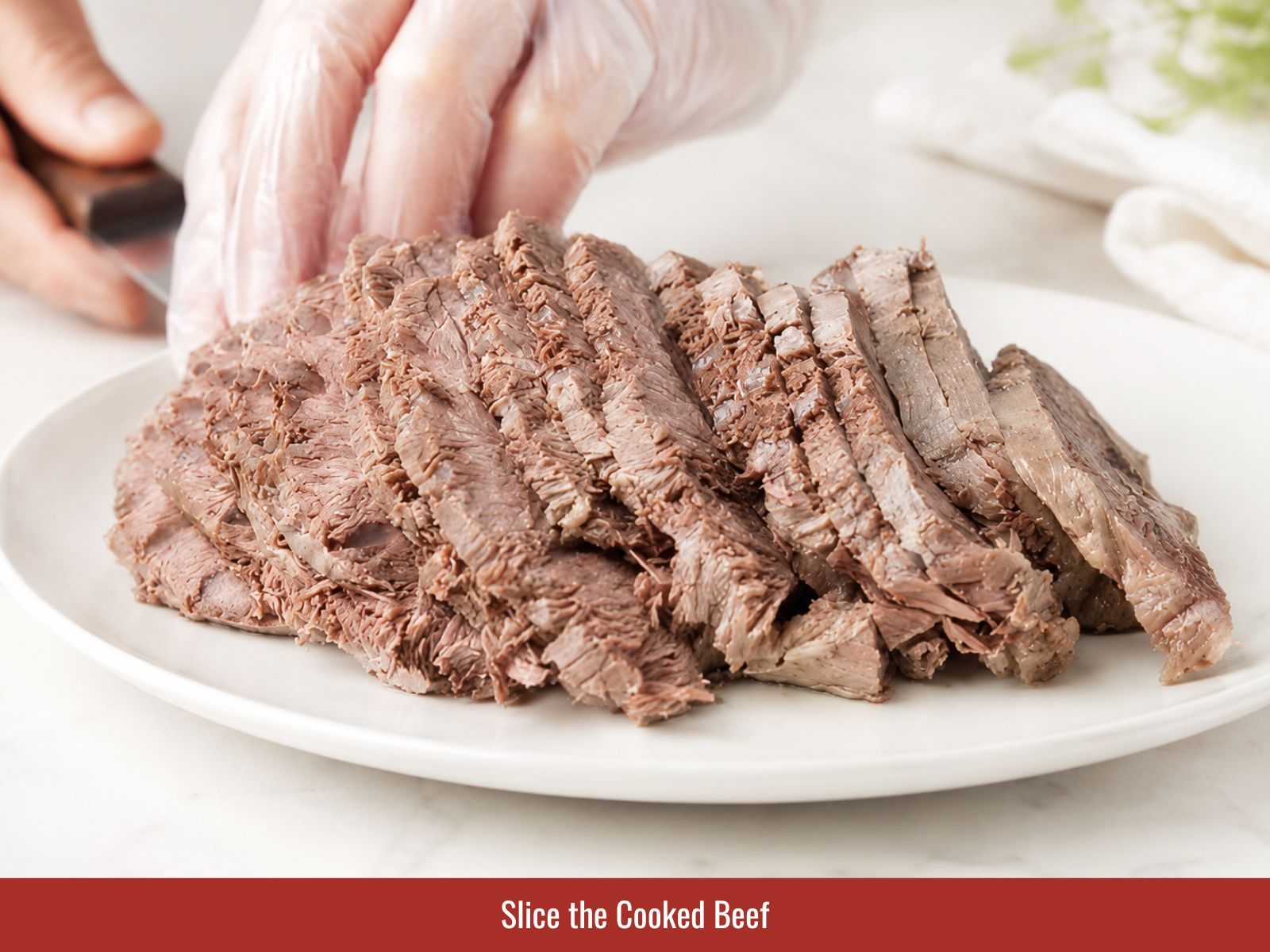 Slicing cooked brisket across grain