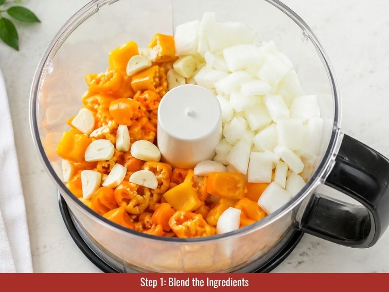 Blend peppers, mango, garlic, onion, and cilantro