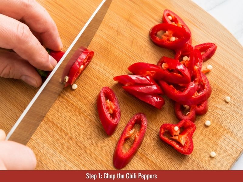 Chop chili peppers for shatta sauce