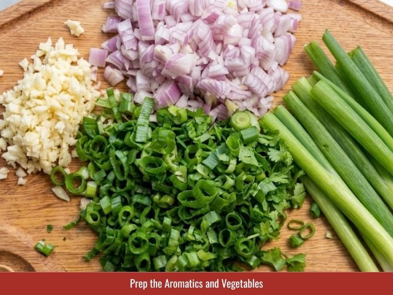 Preparing onion, shallots, garlic, carrots, scallions, and cilantro for Vietnamese macaroni soup