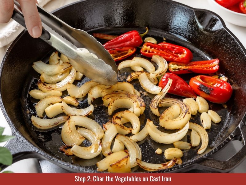 Char Fresno peppers and vegetables on cast iron skillet