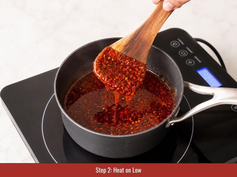 Hot honey sauce heating over low heat