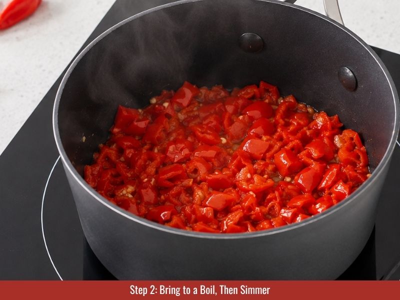 Boil and then simmer peppers with vinegar and salt