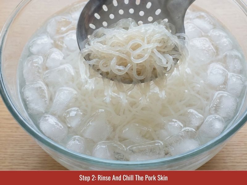 Cleaning and chilling cooked pork skin before adding it to nem chua mixture