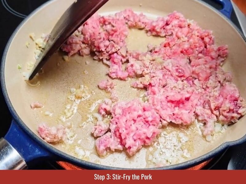 Stir-frying minced pork with shallot to prepare the savory topping for Vietnamese mini pancakes