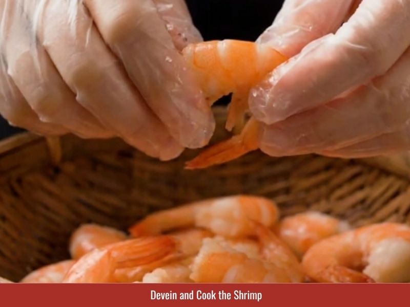 Cleaning and cooking shrimp in seasoned pork broth for goi cuon filling