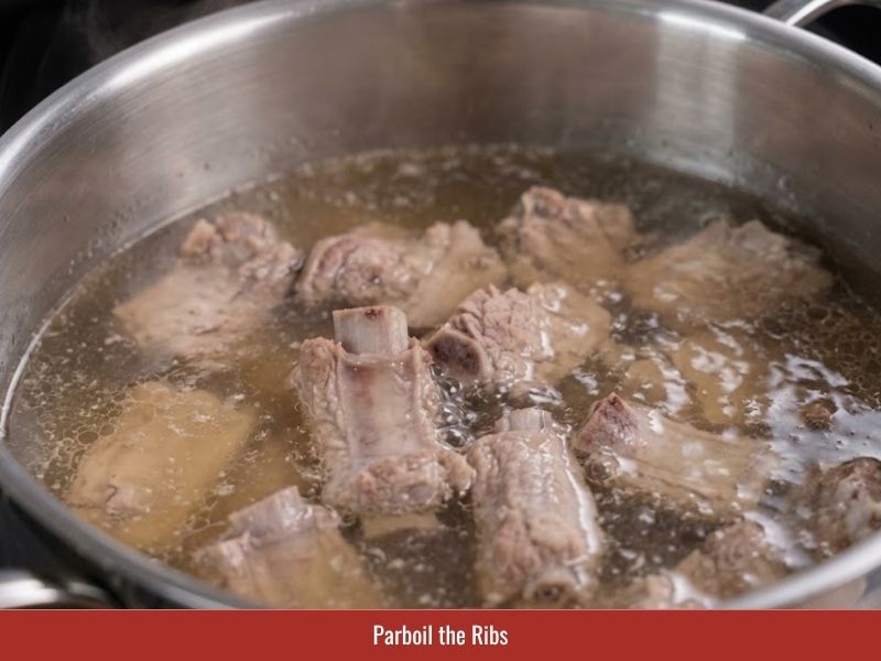 Blanching pork ribs before simmering to create a cleaner clearer sup nui broth