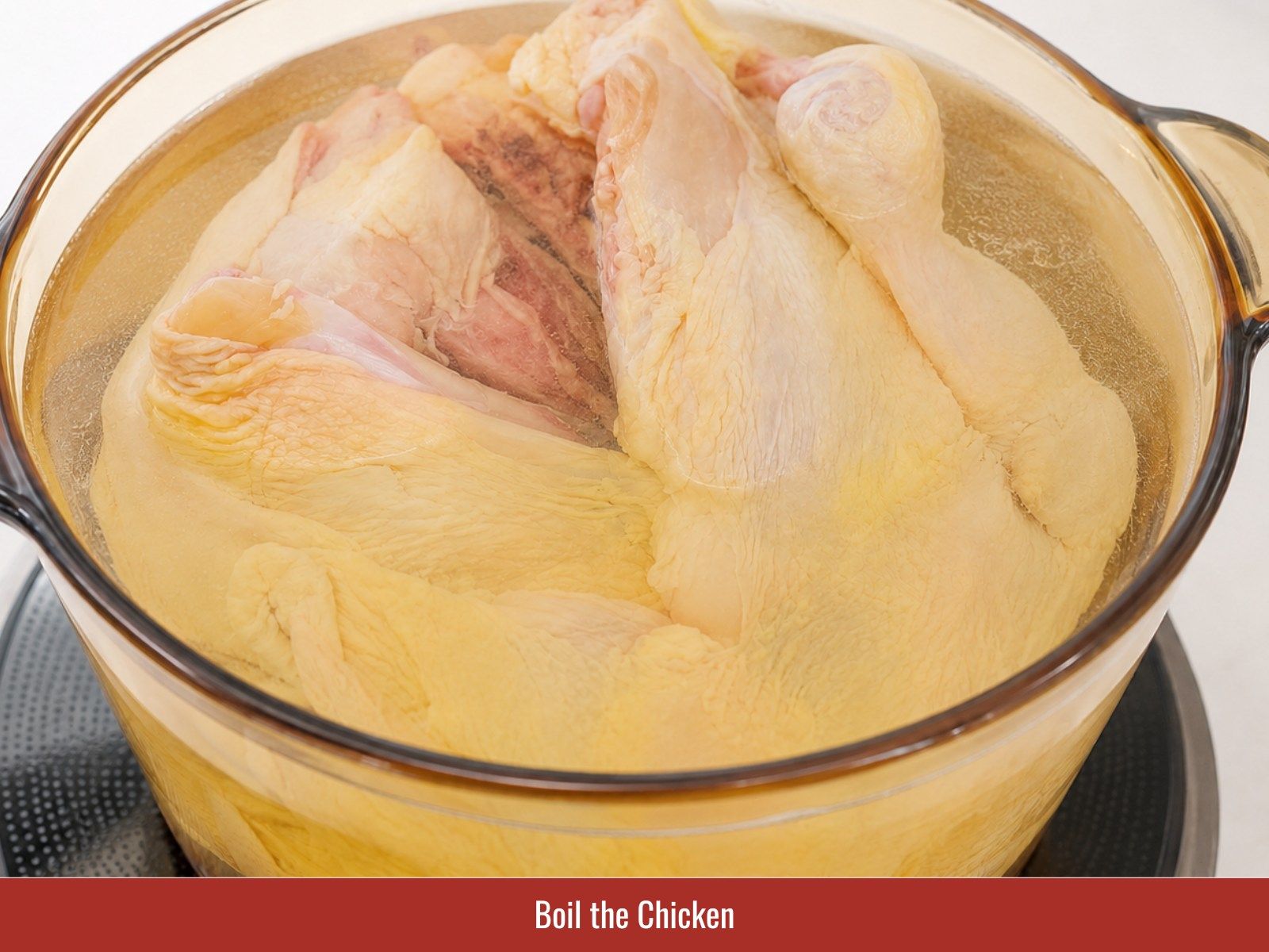 Poach chicken in seasoned broth