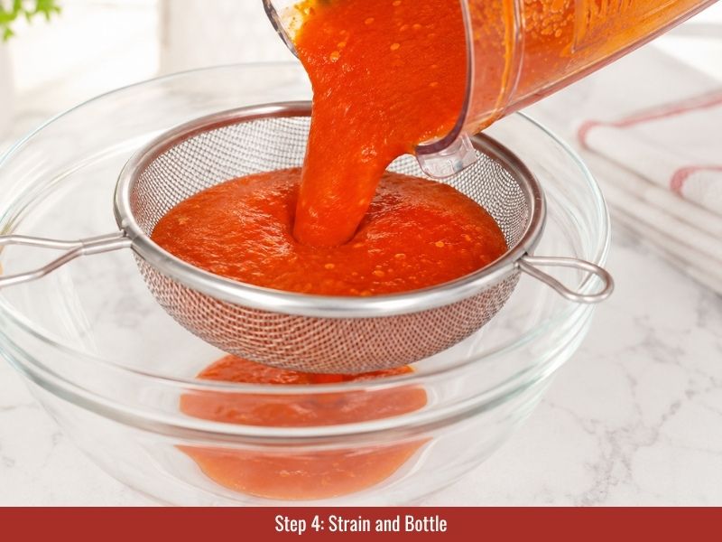 Strain and bottle Louisiana hot sauce for storage