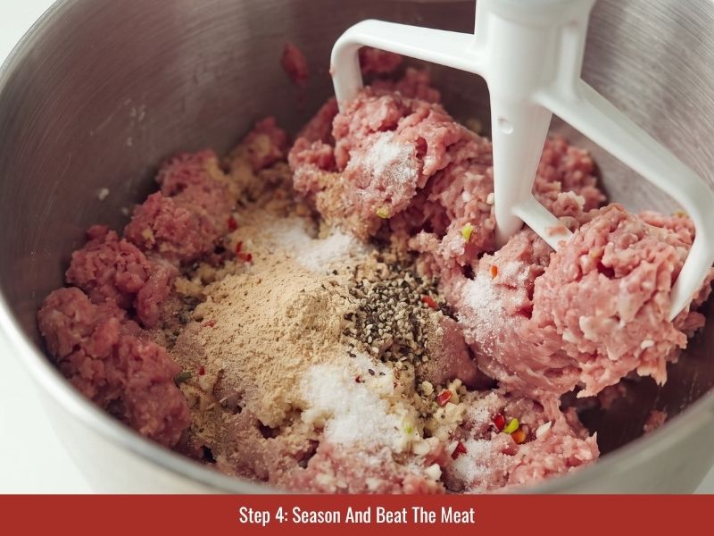 Mixing ground meat with fish sauce, sugar, garlic, chili, pepper, and nem chua seasonings