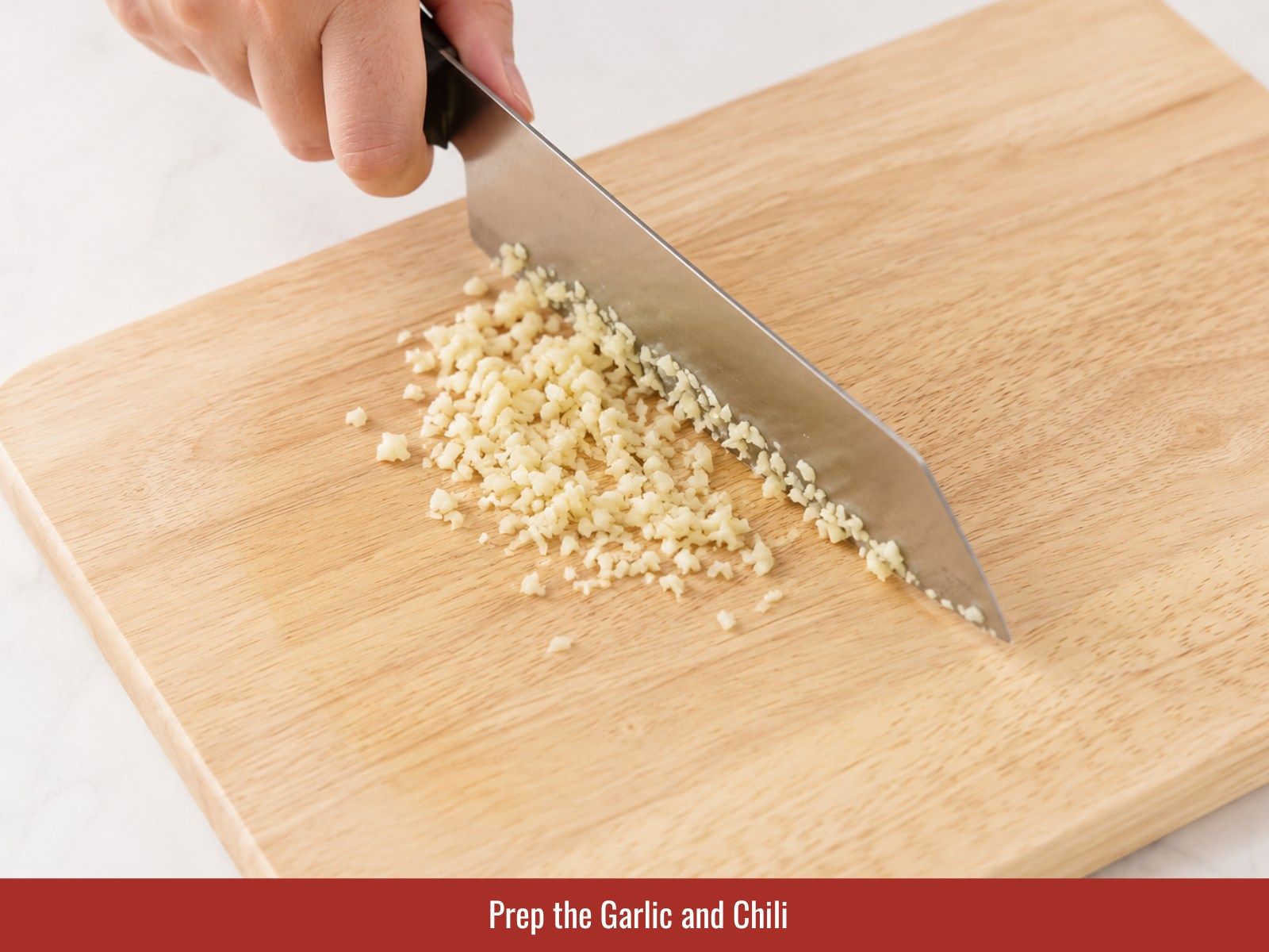 Chop garlic and slice fresh chili