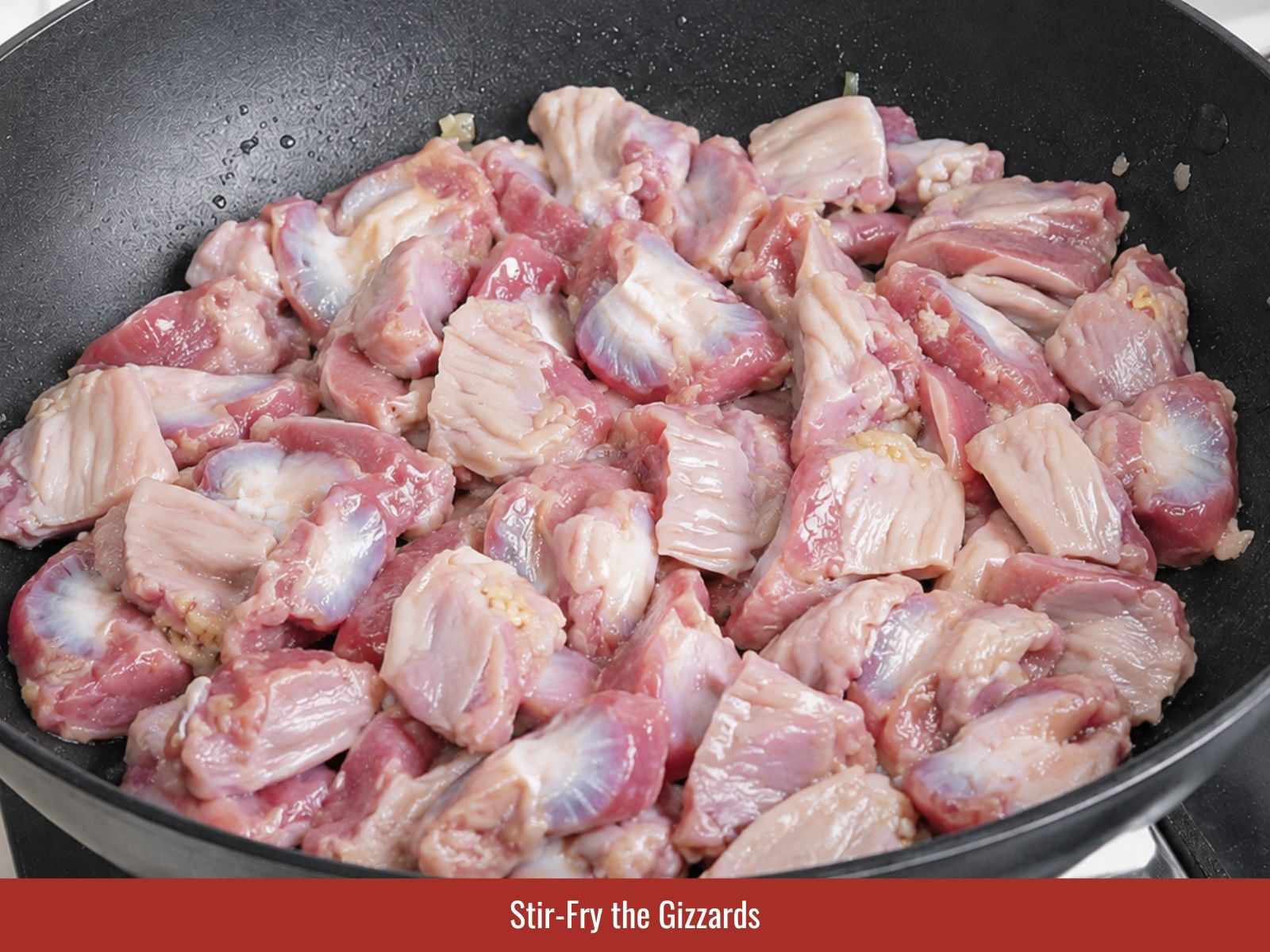 Stir-fry chicken gizzards in rendered fat