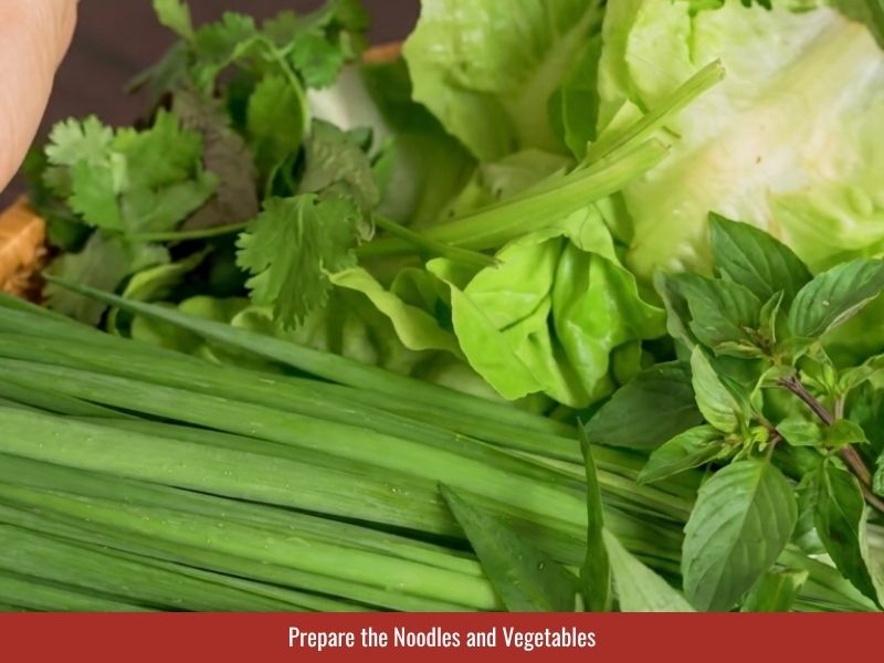 Preparing rice vermicelli, lettuce, herbs, bean sprouts, and garlic chives for fresh spring rolls