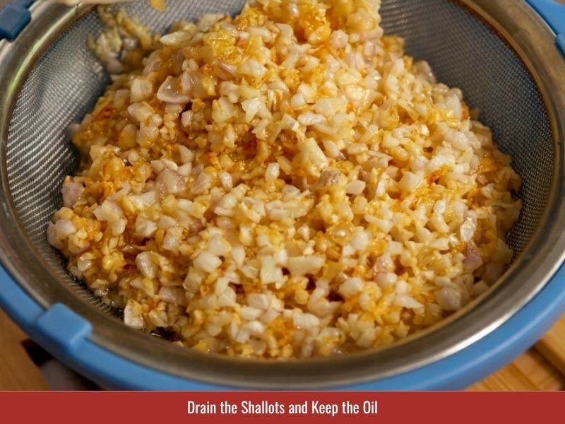 Removing fried shallots from oil and saving shallot oil for cooking and serving banh uot