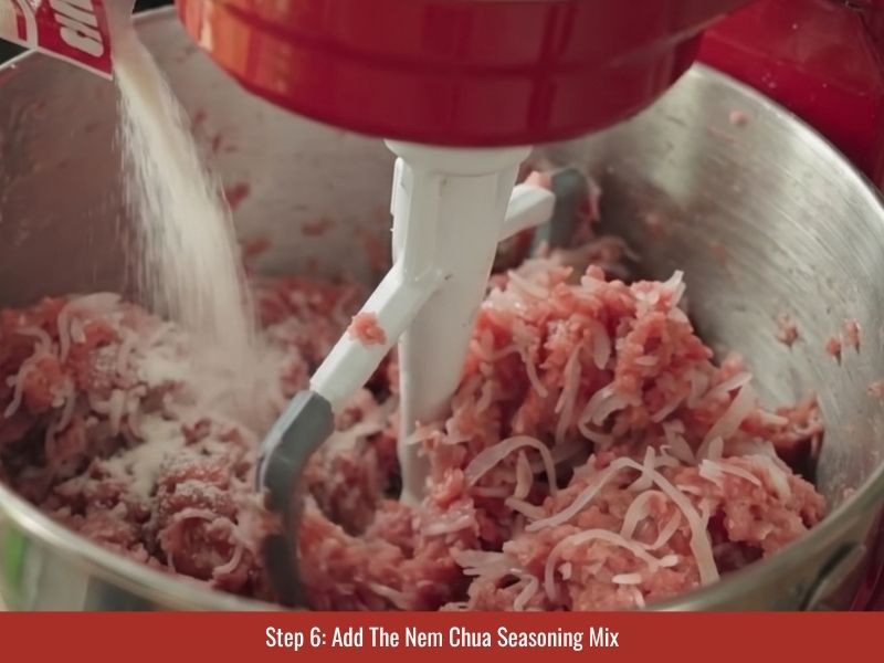 Mixing nem chua seasoning packet into the meat mixture to develop fermented flavor and texture