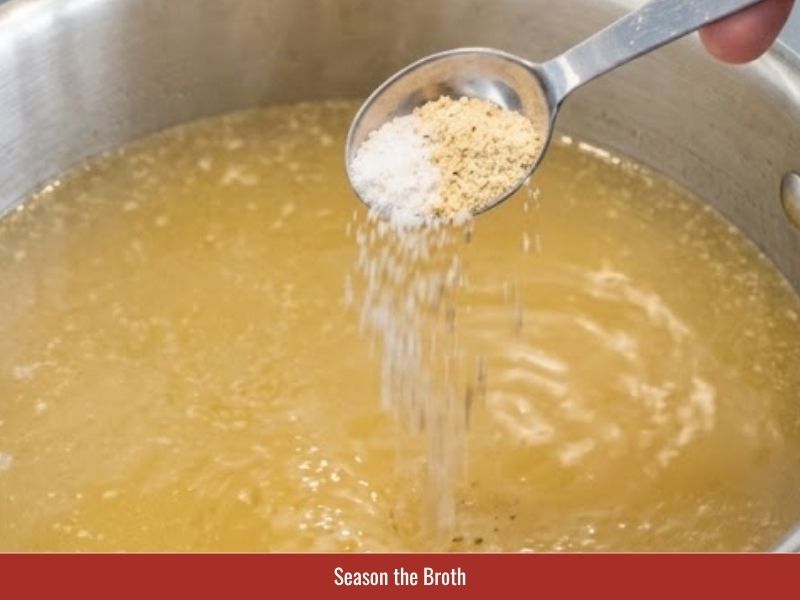Seasoning sup mang cua broth with salt, sugar, and chicken bouillon powder