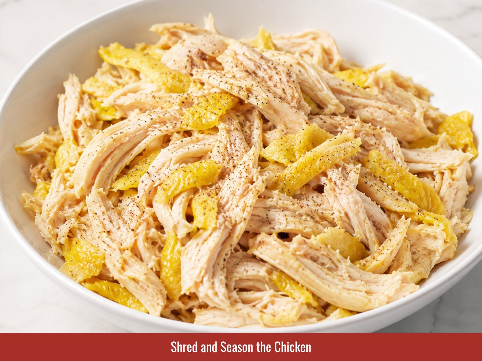 Shred and season poached chicken