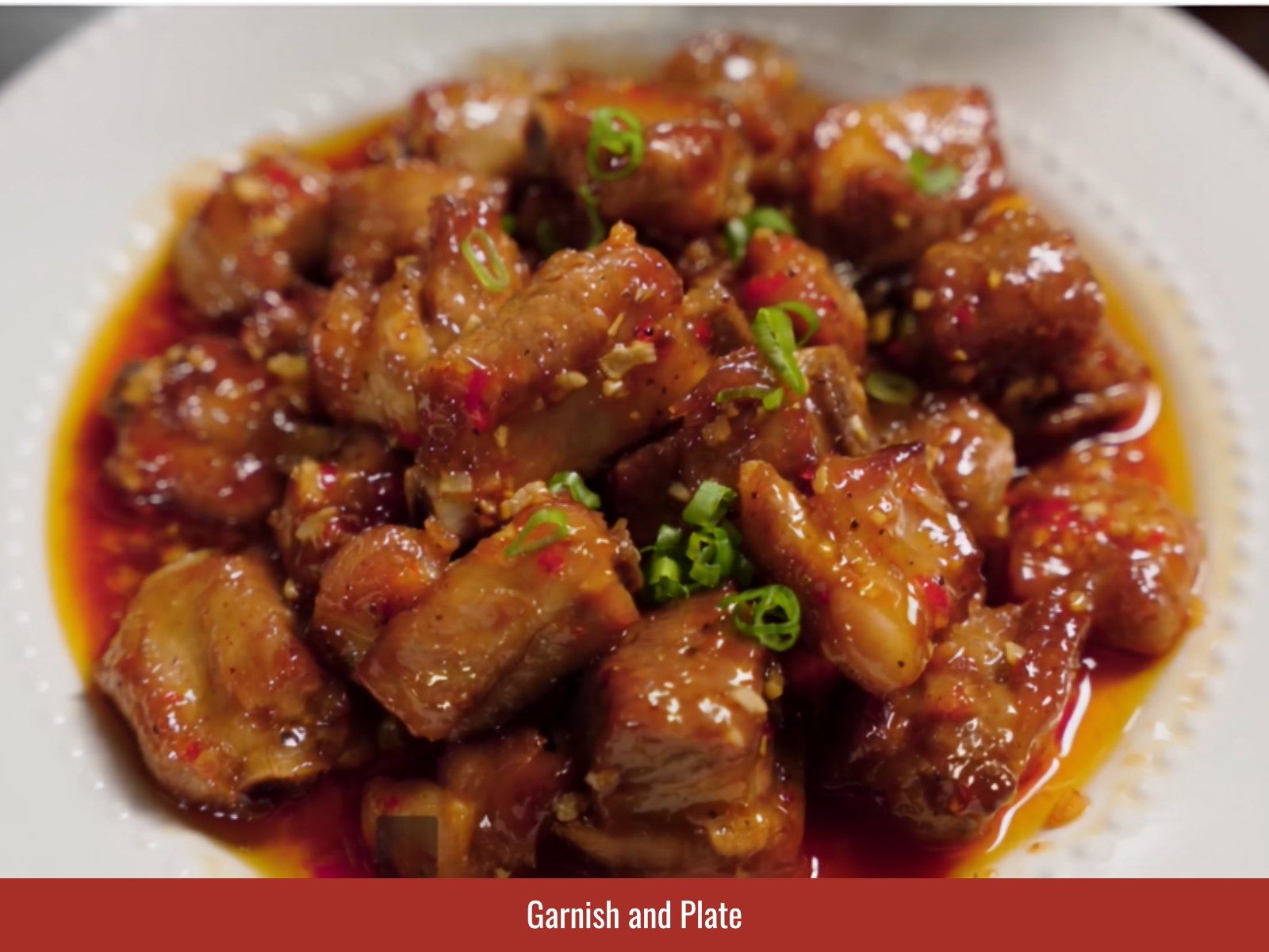 Garnish pan-fried ribs with scallions and garlic
