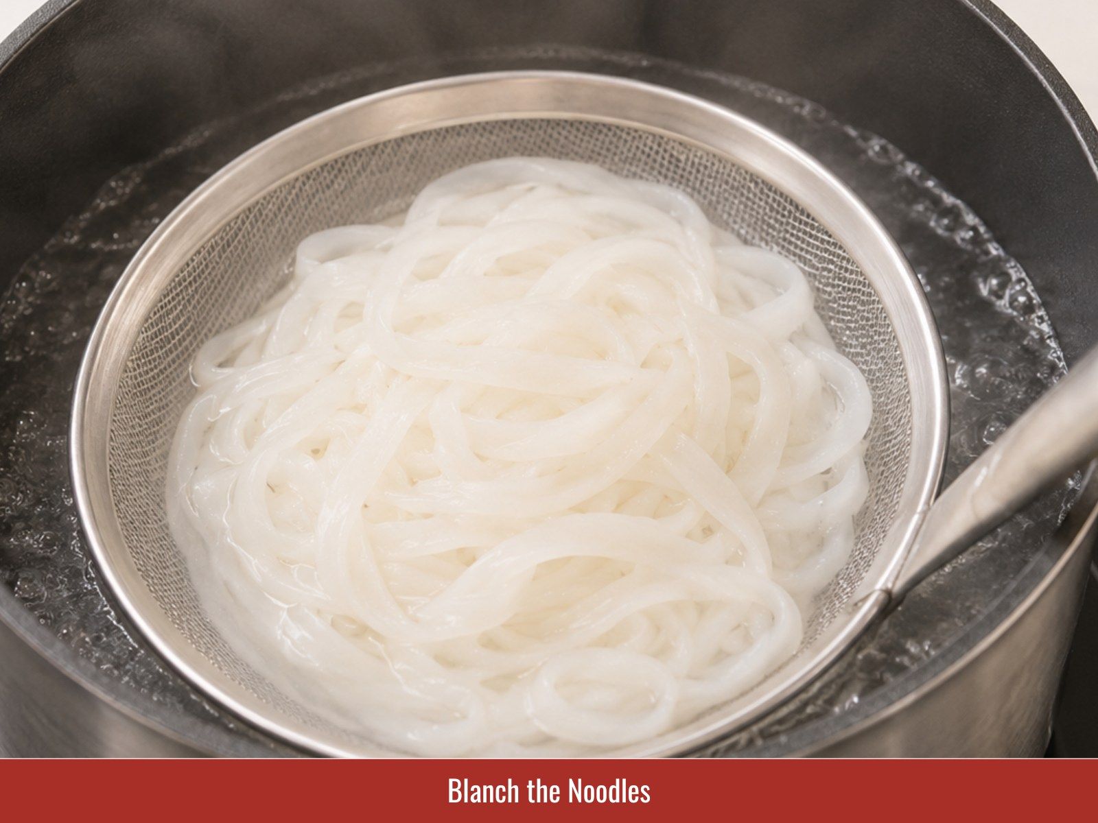 Blanch rice noodles for pho