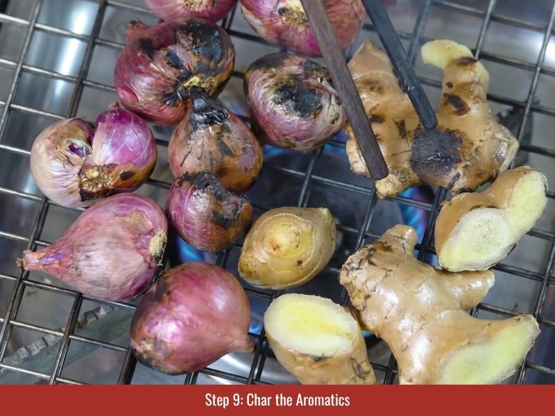 Charring onion, ginger, shallots, and daikon to develop deeper chicken pho broth aroma