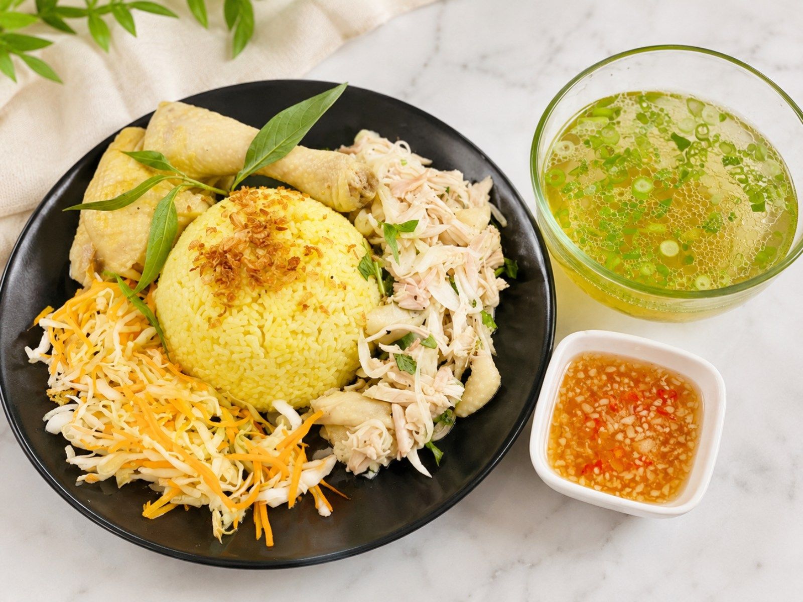 Cơm gà with turmeric rice and poached chicken